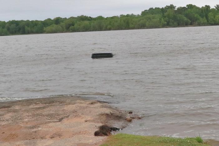 This black Jeep was almost entirely submerged in Lake o' the Pines in Marion County, Texas. It wasn't until a tow truck started to pull it from the water that a woman was spotted inside.