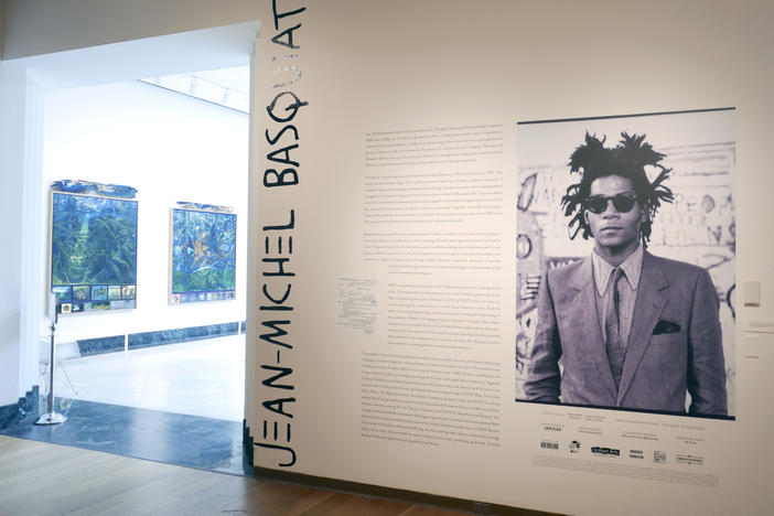 The entrance to an exhibit by artist Jean-Michel Basquiat is seen at the Orlando Museum of Art on June 1, 2022, in Orlando, Fla. A former Los Angeles auctioneer has pleaded guilty in a cross-country art fraud scheme where he created fake artwork and falsely attributed the paintings to artist Jean-Michel Basquiat.