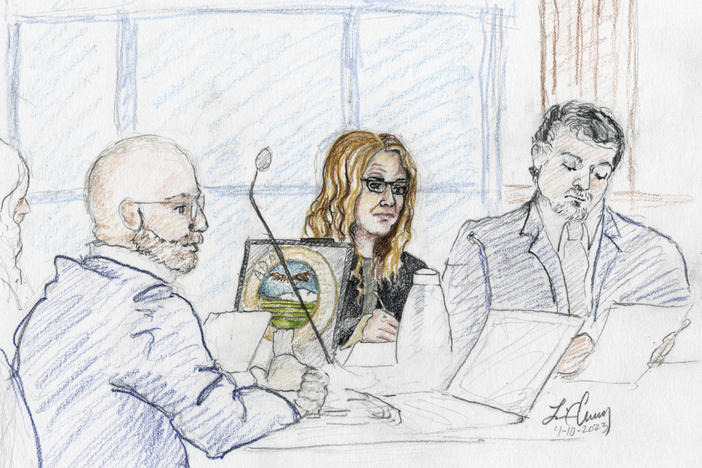 A sketch depicts Madison County prosecutor Rob Wood (from left), Lori Vallow Daybell and defense attorney Jim Archibald during opening statements of Vallow Daybell's murder trial in Boise, Idaho, on Monday.