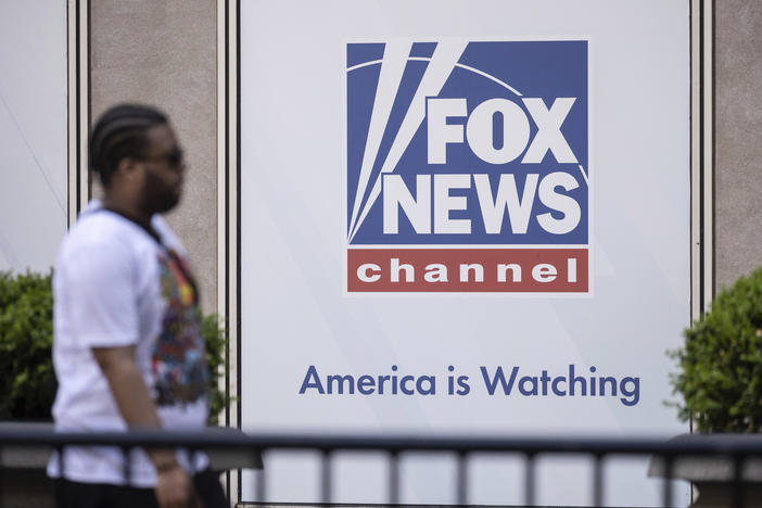 A person walks past the Fox News Headquarters in New York on April 12.