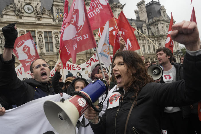 Demonstrate gather outside the Paris town hall on Friday in Paris. France's Constitutional Council on Friday approved an unpopular plan to raise the retirement age to 64, in a victory for French President Emmanuel Macron after three months of mass protests over the legislation that have damaged his leadership.