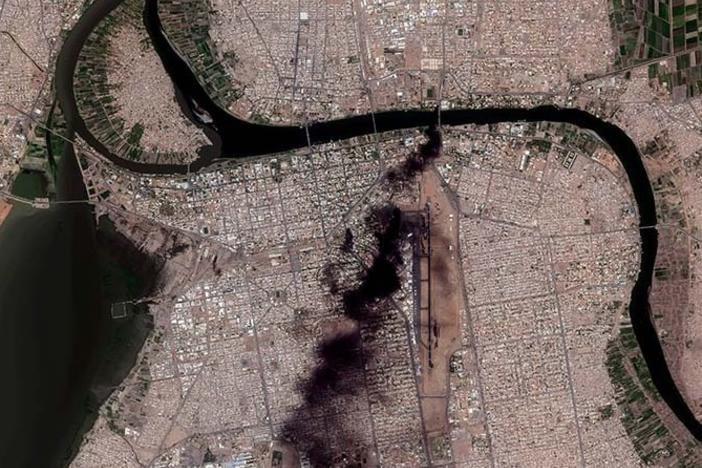Satellite image shows thick, black smoke drifting across the city at multiple locations an overview of fires burning in Khartoum on Sunday.