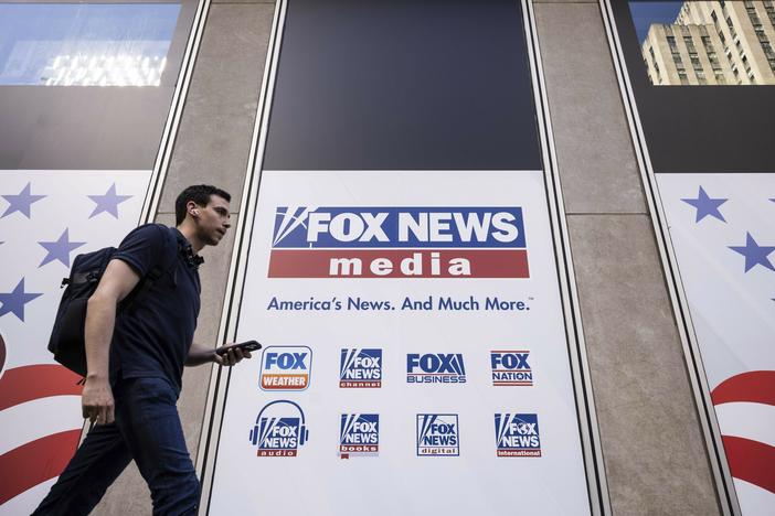 A person walks past the Fox News Headquarters in New York on April 12.
