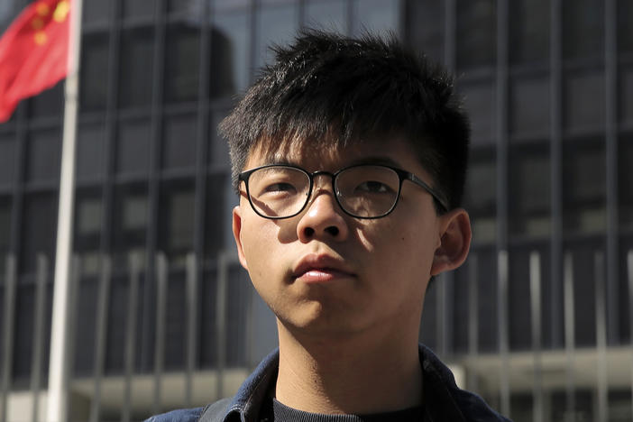 Pro-democracy activist Joshua Wong stands outside the Legislative Council building in Hong Kong on Nov. 28, 2019.