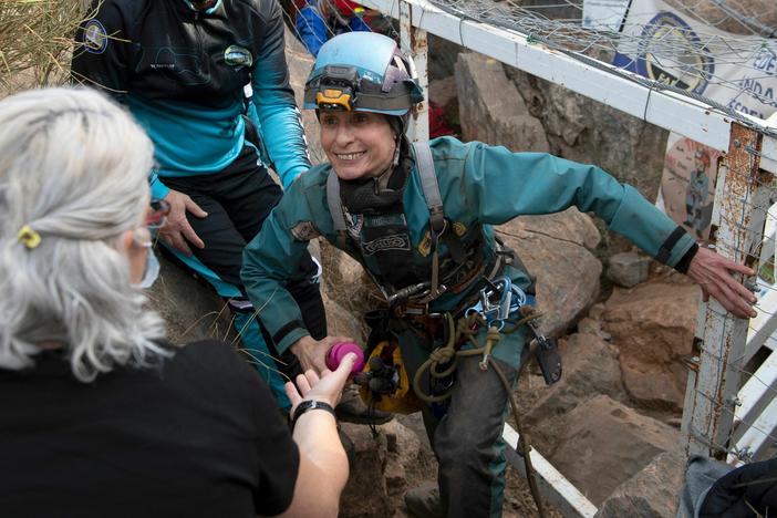 Beatriz Flamini leaves a cave in Los Gauchos, near the Spanish town of Motril on Friday.