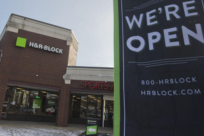 File - An ad banner appears in the parking lot of the H&R Block offices on Thursday, Jan. 8, 2015, in the Atlas District in Washington.