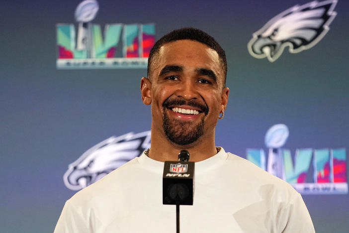 Philadelphia Eagles quarterback Jalen Hurts speaks during an NFL football Super Bowl team availability, Wednesday, Feb. 8, 2023, in Phoenix. Jalen Hurts is set to sign one of the richest deals in NFL history, agreeing to a five-year, $255 million extension with the Philadelphia Eagles, including $179.3 million guaranteed, a person with knowledge of the situation told The Associated Press.