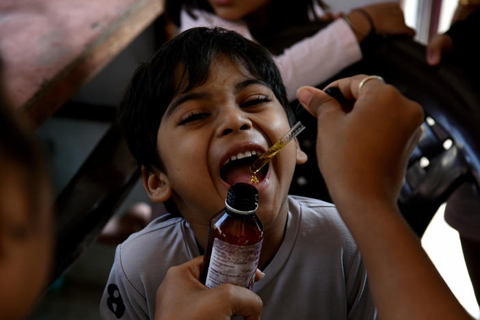 A health worker administers a measles vaccine during a vaccination drive, prompted by a measles outbreak, in Navi Mumbai, India, in December 2022. A new UNICEF report finds that India has the world's largest number of children with zero doses of childhood vaccines: 2.7 million