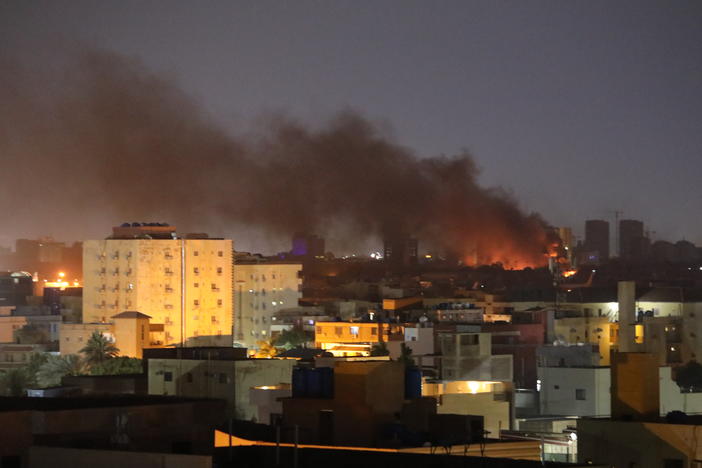 Smoke rises during clashes in the Sudanese capital of Khartoum on April 16. "Some hospitals are being targeted by the warring parties," reports Dr. Ghazali Babiker, country director for the medical charity Médecins Sans Frontières in Sudan.