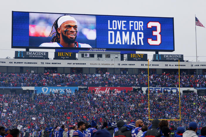 A scoreboard shows a message of support for Damar Hamlin at a January Bills-Patriots game in New York. The Bills' general manager says Hamlin has been cleared to play.