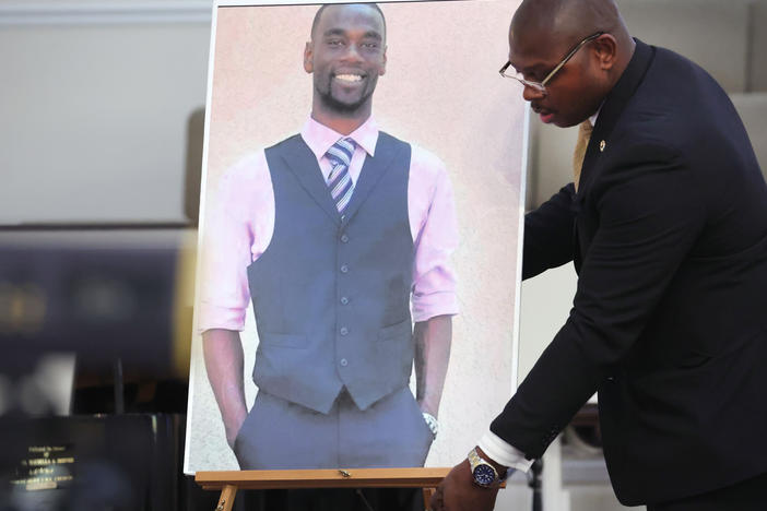 A photo of Tyre Nichols is positioned prior to a press conference on Jan. 27 in Memphis, Tenn. Attorneys representing Nichols' family announced plans to file a civil lawsuit against the city of Memphis, the city's police department, and individual officers over the 29-year-old's January death.