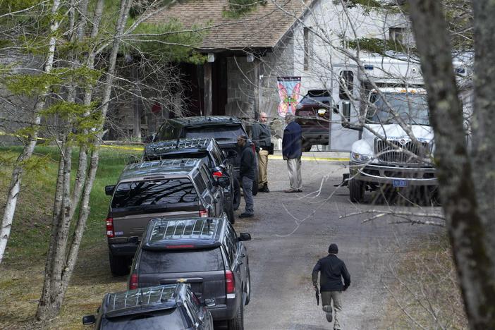 Investigators work at the scene of a deadly shooting, Tuesday, April 18, 2023, in Bowdoin, Maine.