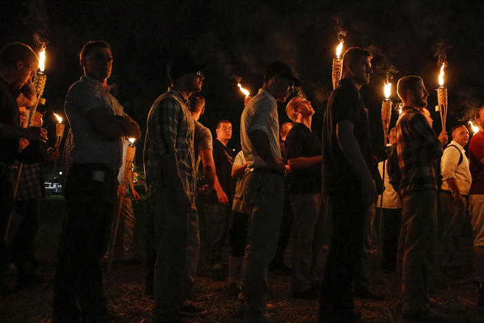 Multiple white nationalist groups march with torches through the University of Virginia campus on Aug. 11, 2017, in Charlottesville, Va.