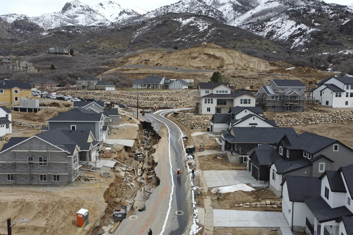 Local officials issued evacuation orders for at least 20 homes as temperatures spiked and snowmelt coursed through the streets on Wednesday, April 12, 2023, in Kaysville, Utah. A record-breaking snow season has raised fears of spring flooding throughout Utah as the weather in mountain regions warms.