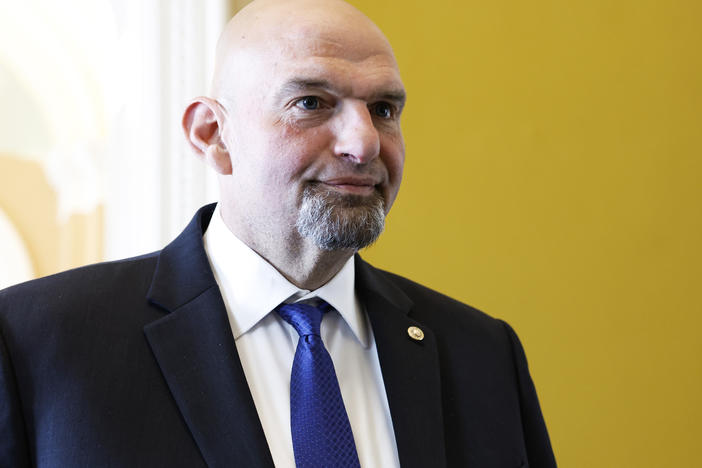 Sen. John Fetterman (D-PA) speaks to reporters on the way to the weekly Senate Policy Luncheons at the U.S. Capitol Building on April 18, 2023 in Washington, DC.