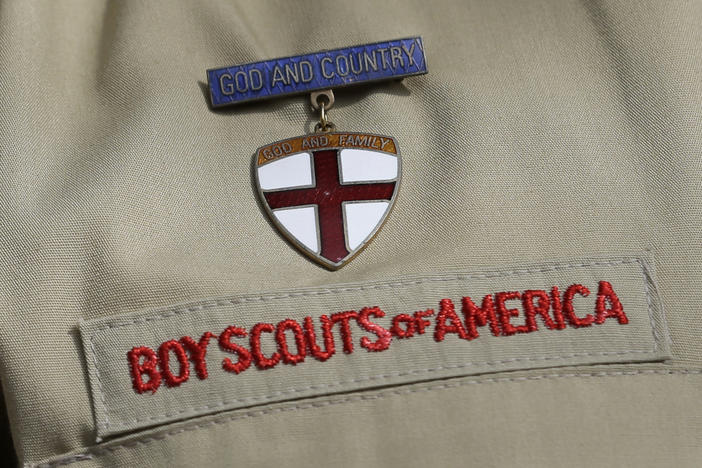 A close up of a Boy Scout uniform is photographed on Feb. 4, 2013, in Irving, Texas. On Tuesday, March 28, 2023, a federal district court judge upheld the approval of a $2.4 billion bankruptcy reorganization plan aimed at resolving tens of thousands of child sexual abuse claim against the Boy Scouts of America.