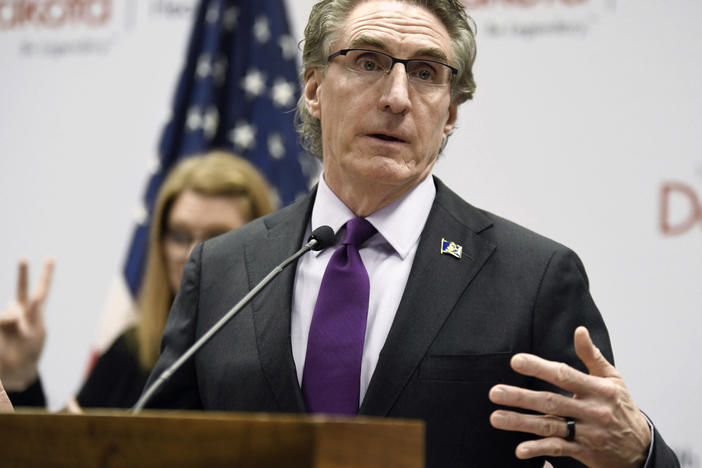 North Dakota Gov. Doug Burgum speaks at the state Capitol on April 10, 2020, in Bismarck, N.D. Burgum has signed a veto-proof bill into law, Thursday, April 20, 2023, that restricts transgender health care and criminalizes providers who give gender-affirming care to people under 18.