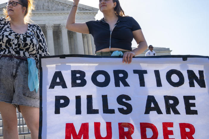 Anti-abortion advocates demonstrate against abortion pills outside the Supreme Court on Friday.