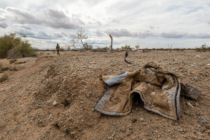 Jacqueline Arellano hikes through a wash she suspects migrants move though on their way north after crossing the border. She volunteers with Border Kindness , a group that is extending its services to  desert areas around Yuma, Ariz., to assist lost or hurt migrants.