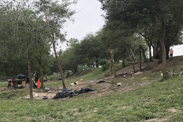 Makeshift tents and debris are seen at a migrant camp in Matamoros, Mexico, on Friday. About two dozen makeshift tents in the area were set ablaze and destroyed, across the border from Texas this week, witnesses said.