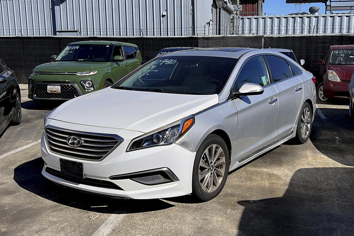 A Hyundai sedan sits in the parking lot of East Bay Tow Inc., where California Attorney General Rob Bonta held a news conference on Thursday.