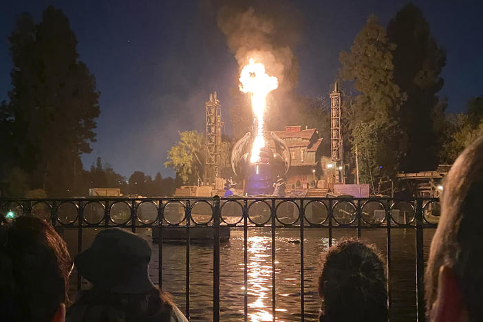 This photo courtesy of Shawna Bell shows a fire during the "Fantasmic" show in the Tom Sawyer Island section of Disneyland resort in Anaheim, Calif., on Saturday, April 22, 2023.