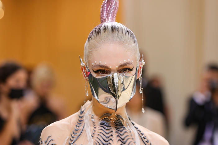 Grimes, pictured in 2021, said she wants to be a "guinea pig" for music creators working with Artificial Intelligence.