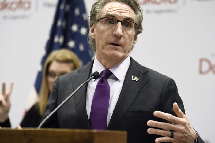 North Dakota Gov. Doug Burgum speaks at the state Capitol earlier this month in Bismarck, N.D. Burgum signed an abortion ban at six weeks of pregnancy — even in cases of rape or incest — into law on Monday.
