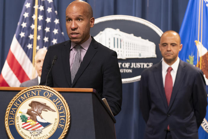 Under Secretary of the Treasury for Terrorism and Financial Intelligence Brian Nelson, with U.S. Attorney Matthew Graves for the District of Columbia, speaks during a news conference on Tuesday at the Department of Justice in Washington.