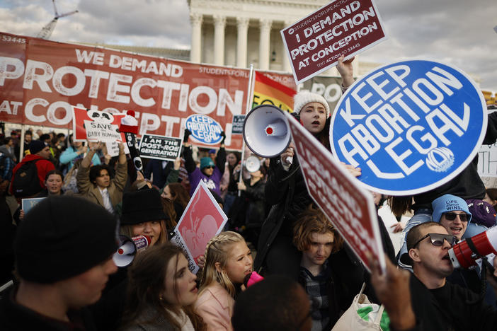 Anti-abortion and abortion rights activists protest in Washington, D.C. at the March for Life rally in January. The decision triggered strict abortion bans in more than a dozen states. A new study shows widespread confusion about abortion bans at Oklahoma hospitals.