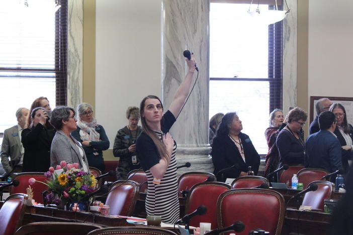 Rep. Zooey Zephyr on the Montana House floor as protesters chant "let her speak," on April 24, 2023. Zephyr, one of Montana's first transgender lawmakers, is blocked from speaking on the House floor after she condemned Republicans for advancing anti LGBTQ legislation.