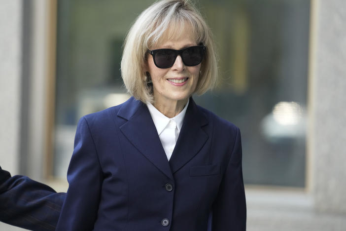 Former advice columnist E. Jean Carroll arrives to federal court in New York on Wednesday. Jurors have been seated in the trial over Carroll's claim that former President Donald Trump raped her nearly three decades ago in a department store dressing room.