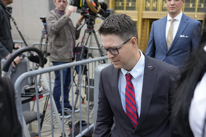 Brian Kolfage leaves court in New York on Wednesday after being sentenced for defrauding donors to the We Build the Wall effort.