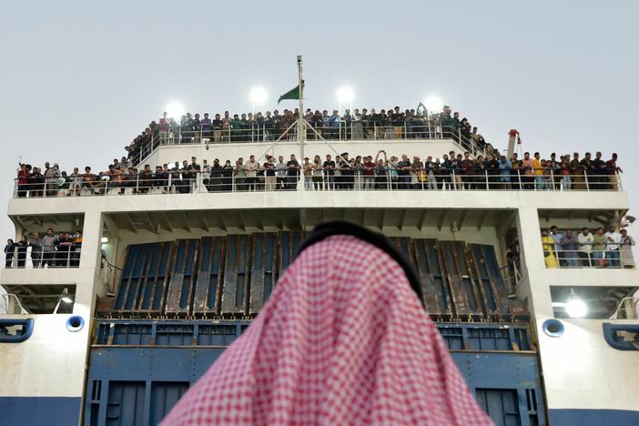 A boat from Sudan with nearly 1,700 civilians from more than 50 countries arrives in Jedda, Saudi Arabia on Wednesday after crossing the Red Sea. Foreigners and Sudanese citizens have been fleeing Sudan since fighting broke out between two rival generals nearly two weeks ago.