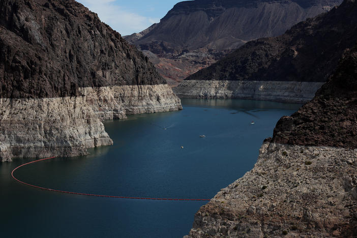 A bleached "bathtub ring" is visible on the banks of Lake Mead on Aug. 19, 2022. The lake's water levels continue to fall, leading to a grim pattern for local authorities: the discovery of human remains.