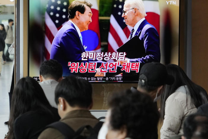 A TV screen shows an image of President Joe Biden and South Korean President Yoon Suk Yeol in Washington, at the Seoul Railway Station in Seoul, South Korea, on Thursday. Biden and Yoon unveiled a new plan Wednesday to counter North Korea's nuclear threat. The words read "The South Korea-U.S. summit and adoption of the Washington Declaration."