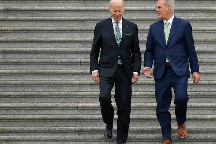 President Joe Biden and Speaker of the House Kevin McCarthy walk outside the U.S. Capitol at a Saint Patrick's Day event in March. The two haven't discussed the debt ceiling since February.