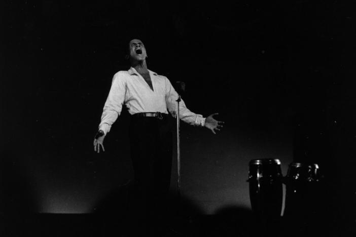 Calypso singer and actor Harry Belafonte performs in concert at London's Kilburn National Ballroom on Aug. 10 1958.