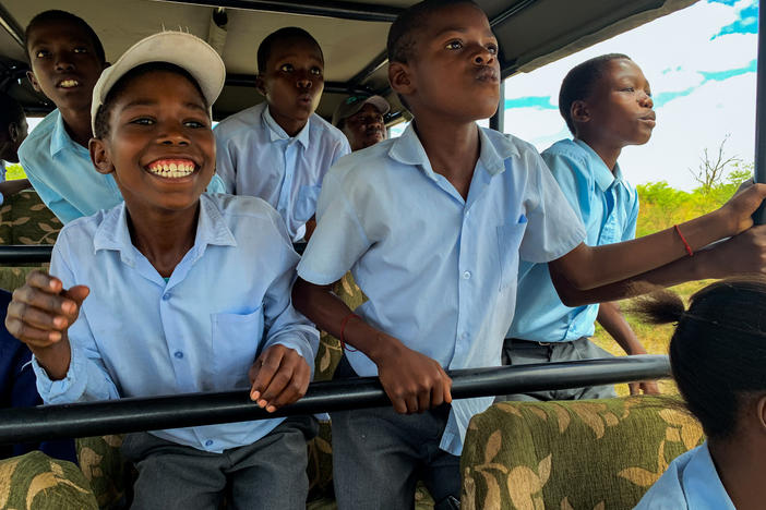 Sixth graders from Habu Primary School in Botswana on a safari. The trip is the high point of a multi-pronged effort by the nonprofit Wild Entrust to resolve a chronic conflict between rural villagers and the wild animals that destroy their crops.