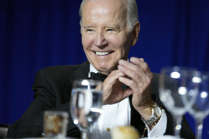 President Joe Biden claps as Comedian Roy Wood Jr., a correspondent for "The Daily Show," speaks during the White House Correspondents' Association dinner at the Washington Hilton in Washington, Saturday, April 29, 2023. (AP Photo/Carolyn Kaster)