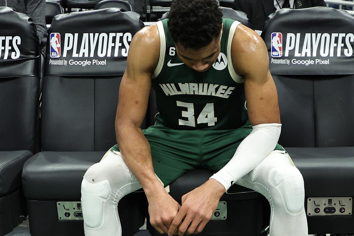 Giannis Antetokounmpo of the Milwaukee Bucks sits on the bench after losing Game 5 of the Eastern Conference First Round Playoffs against the Miami Heat in overtime.
