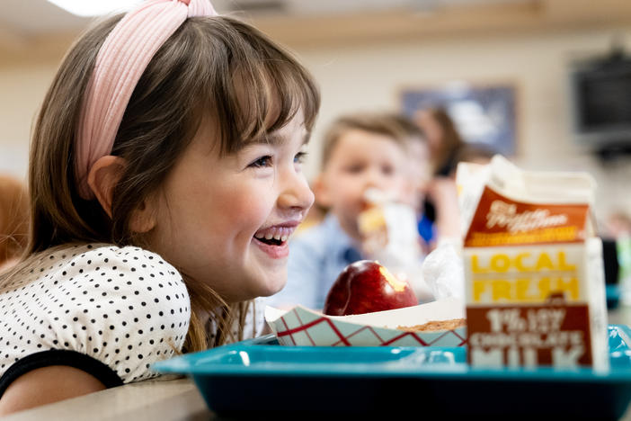 Amelia, a 5-year-old student at Oakville Elementary School, socializes during lunch in March at the school in Oakville, Mo. Kids who eat school meals tend to have a healthier diet.