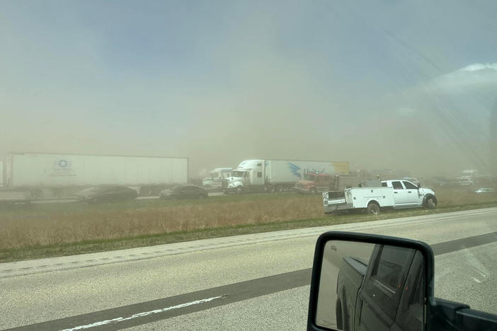 A view of vehicles in a dust storm that cut visibility to near zero and triggered a series of chain-reaction crashes  on a highway in Springfield, Ill.