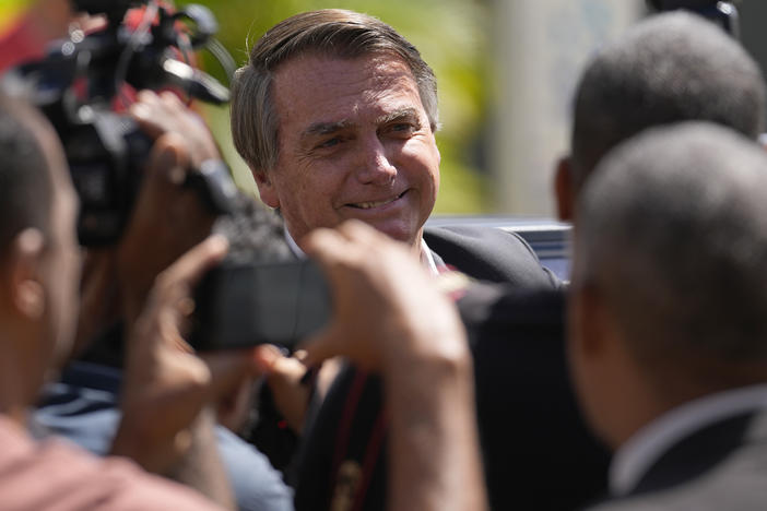 Former Brazilian President Jair Bolsonaro leaves Federal Police headquarters after giving testimony over the Jan. 8 attacks, in Brasilia, April 26.