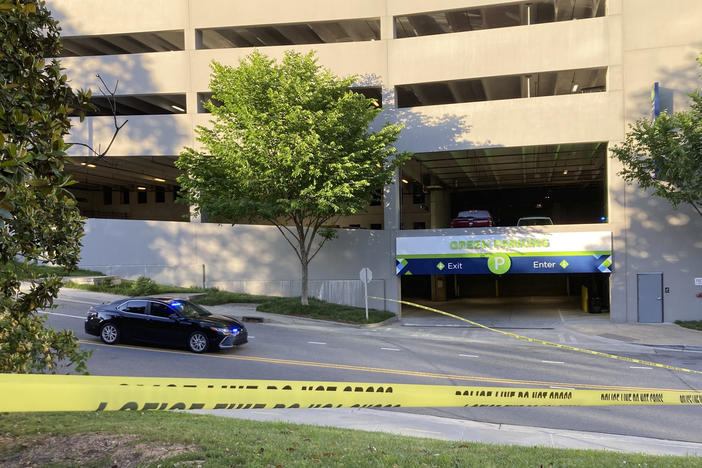 Authorities say a gunman who opened fire, Wednesday, May 3, 2023, at an Atlanta medical facility, killing one, stole a vehicle shortly after the shooting in order to flee from police. The vehicle was later found at a Cobb County parking garage, pictured here on Monday, that is part of the Battery, a mixed-use development near the stadium where the Atlanta Braves play.