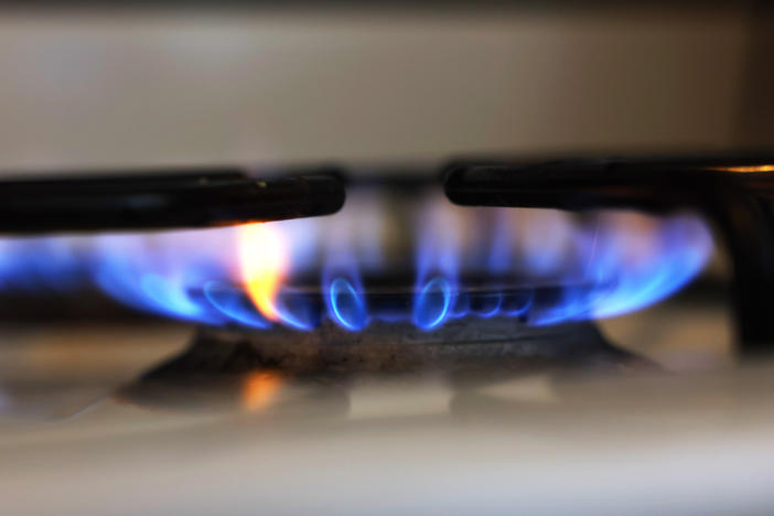 In this photo illustration, a flame burns on a gas stove on April 28, 2023 in New York City.