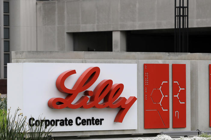 A sign for Eli Lilly & Co. sits outside their corporate headquarters in Indianapolis on April 26, 2017. The company said Wednesday, May 3, 2023, that its experimental Alzheimer's drug appeared to slow worsening of the mind-robbing disease in a large study.