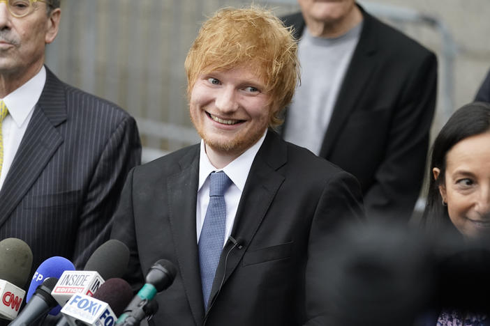 Recording artist Ed Sheeran prepares to speak to the media outside New York Federal Court after wining his copyright infringement trial on Thursday in New York. A