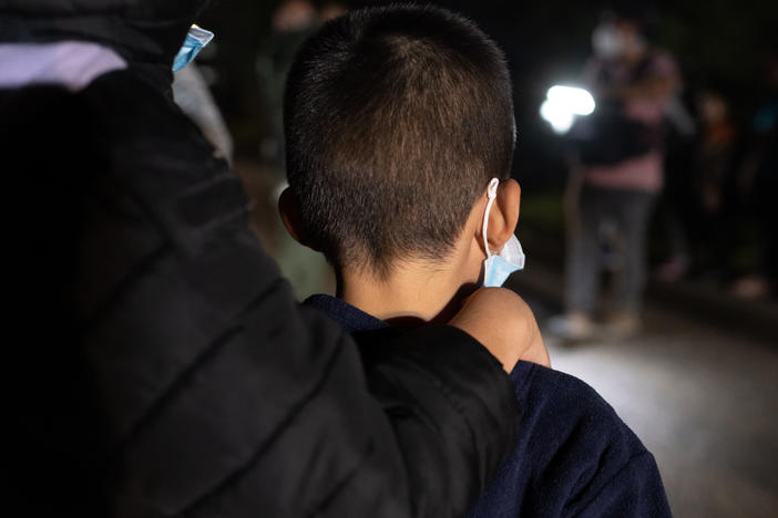 Unaccompanied immigrant minors wait to be processed by Border Patrol agents after they crossed the Rio Grande into south Texas on April 29, 2021.