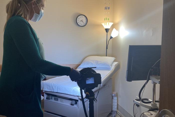 After a patient leaves, Jacqueline Towarnicki prepares the examination room in case she gets a call that someone else needs to see a sexual assault nurse examiner.